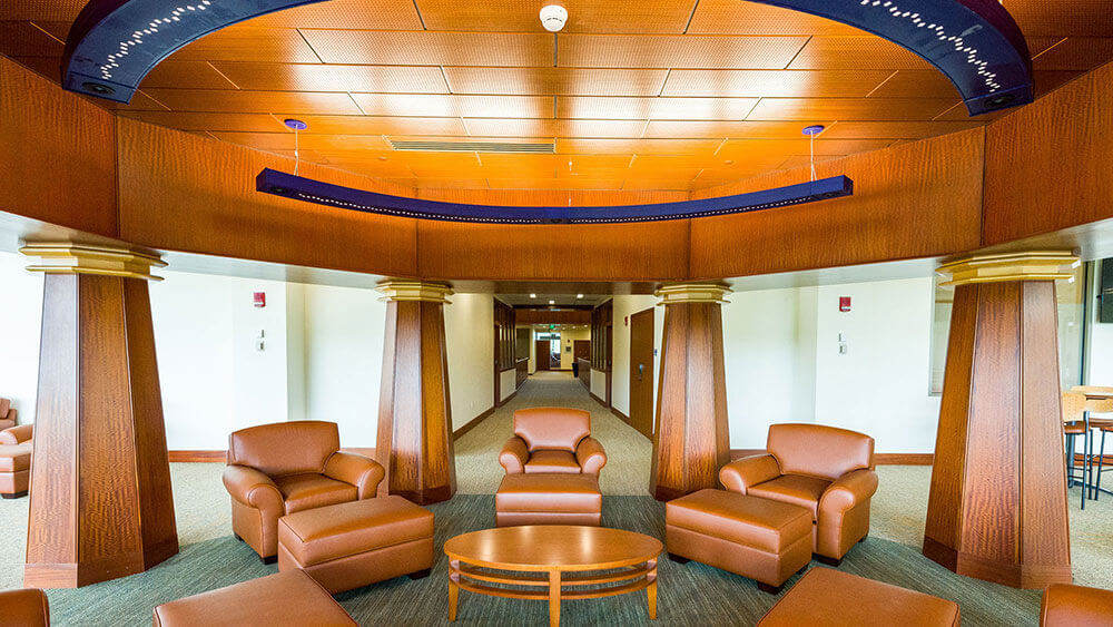 A study area with brown leather chairs in the School of Law Center