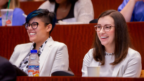 Two law students in the ceremonial courtroom